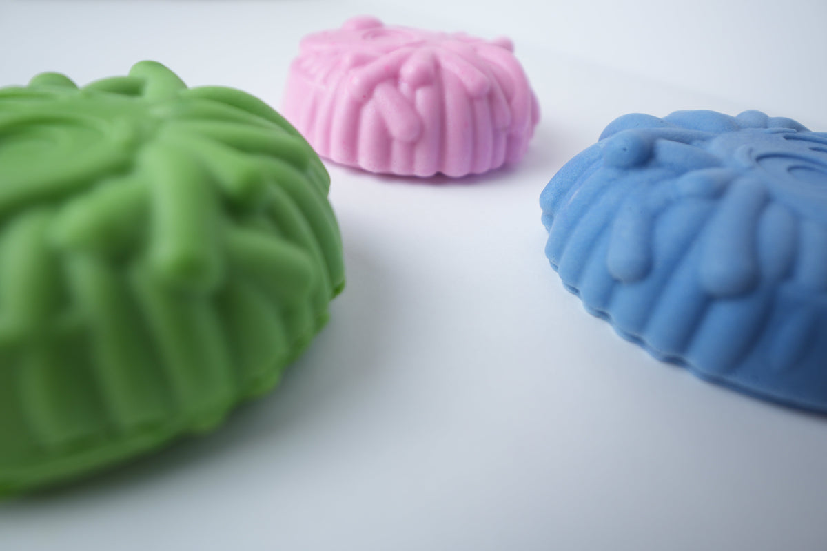 Mr. Scrubbadubba soap bars showing the textured mop-hair back